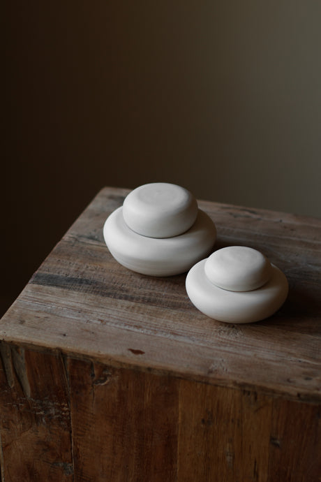 Crafted with a textured surface inspired by natural stone formations, Stone Jars are ideal for storing small items or serving as a striking statement piece.